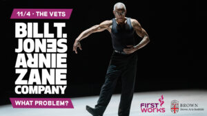 Dancer on stage extends right leg to the side and arms are rounded towards the right side