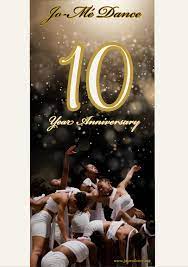 10 year anniversary poster with dancers in white costumes leaning on each other and reaching outward