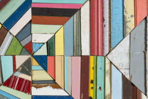 Collage of images of colorfully painted strips of wood