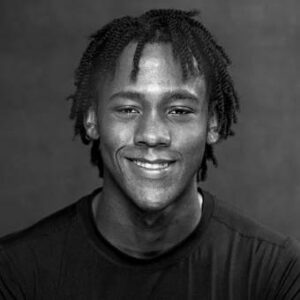 Black and white headshot of Tyson Ali Clark