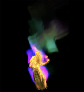 Holograph-like image of dancer in a dark space leaving a trail of light behind.