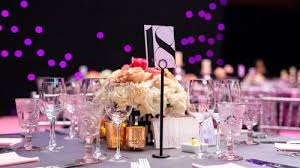 Photo of an elegant gala table set up with glasses and flowers.