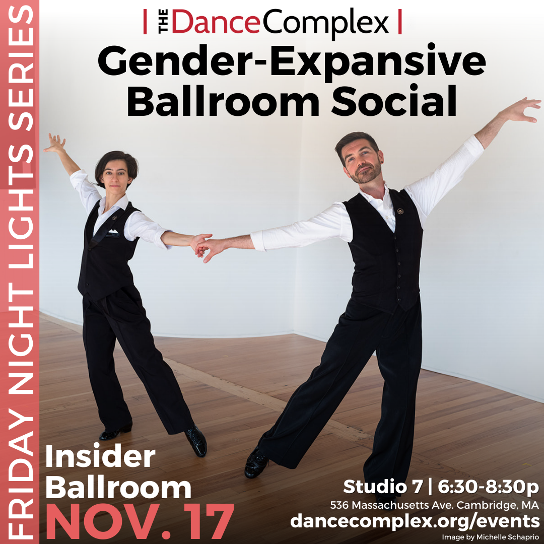 Two ballroom dancers wearing the same pants, white long sleeve and black vest hold hands and reach outer arm slightly above shoulder line.