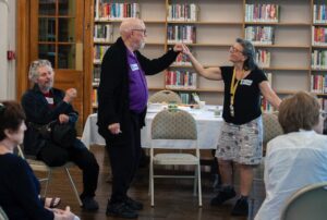 Elder dancers moving together.
