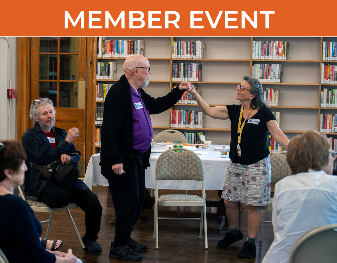 A man and woman facing each other as though in courtly dance pose.