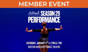 Image of a dance facing away from the camera with their arms stretched to the sides. Dancer is seen from the waist up wearing tight black clothing against a vibrant blue backdrop.