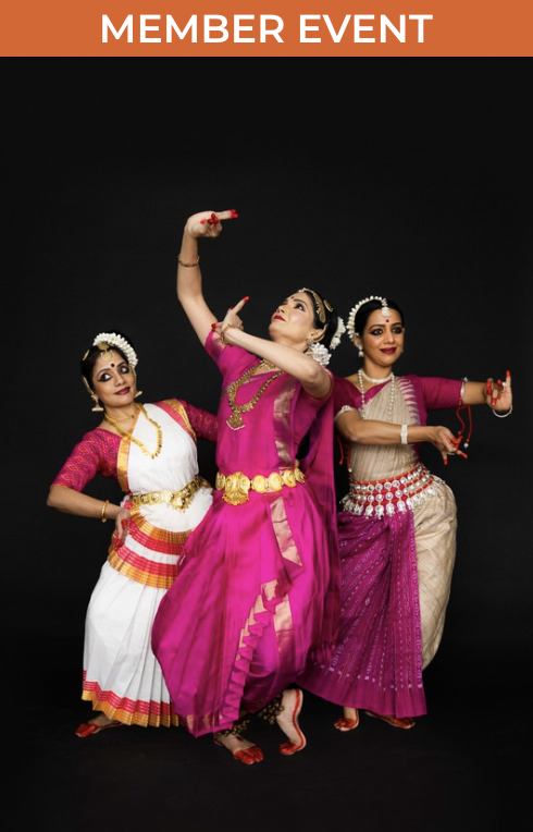 Image of three classical Indian dancers posed standing in colorful attire against a black background