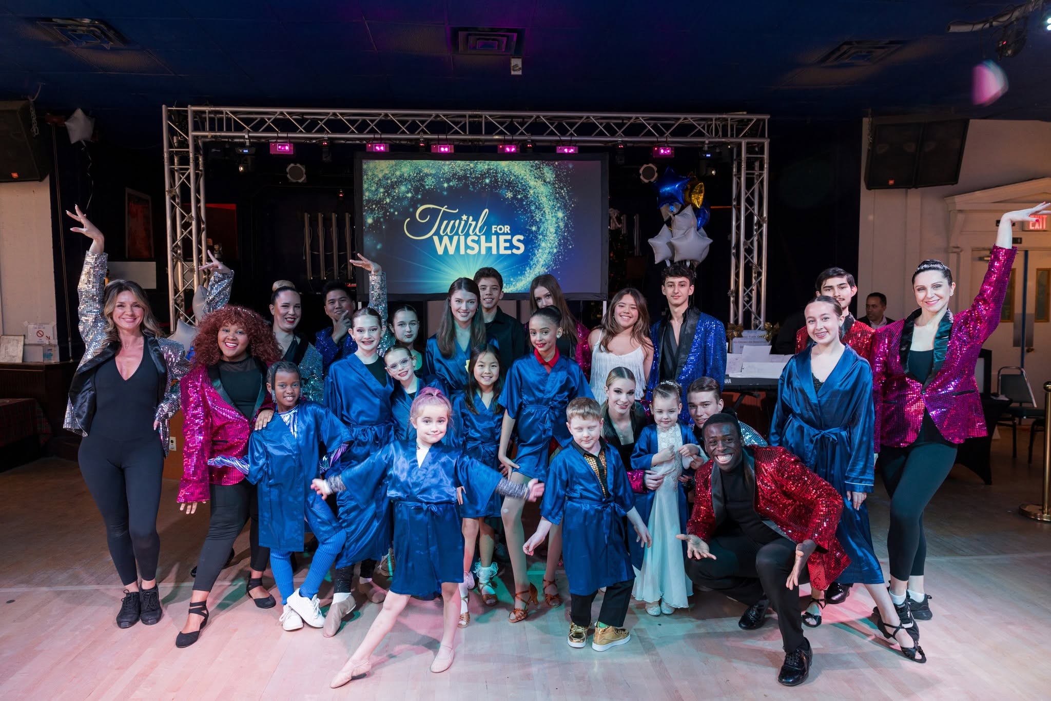 Group photo of child and adult dancers at Twirl For Wishes 2025